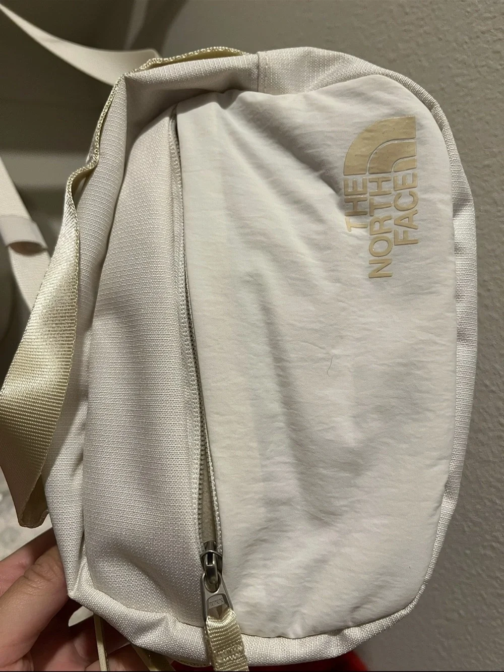 The North Face Cream Crossbody Bag with Subtle Gold Logo